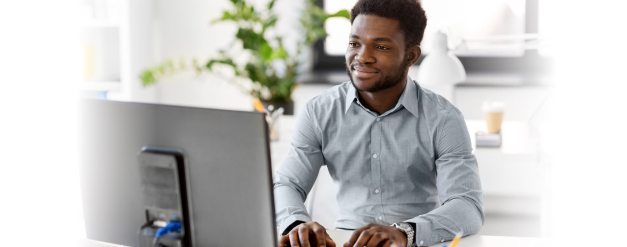 African American man in front of computer